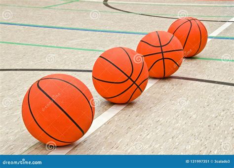 line of basketballs.